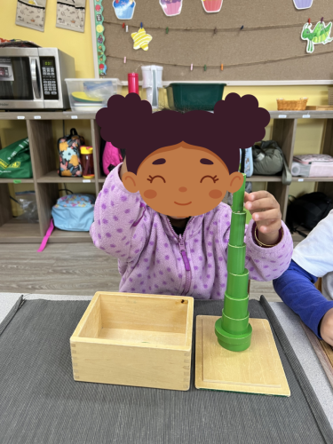 Childcare student in North Delta stacking green cylinders during Montessori play at BKMCC.
