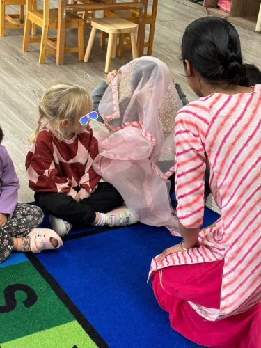 Children in North Delta childcare enjoy festive Diwali circle time at BKMCC.