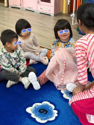 Preschoolers in North Delta childcare explore Diwali traditions with their educator.