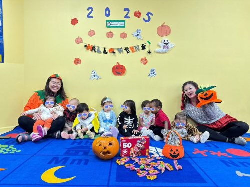 Infants and teachers in Halloween costumes at BKMCC Childcare in North Delta.