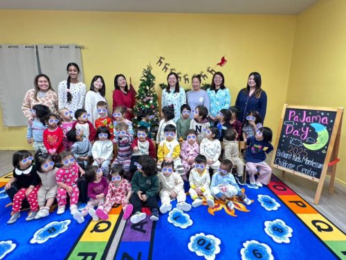 Full group of BKMCC staff and children wearing pajamas for a center-wide event.