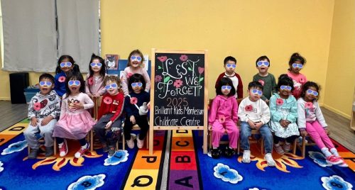 Preschool group at BKMCC Childcare in North Delta wearing poppies for Remembrance Day.
