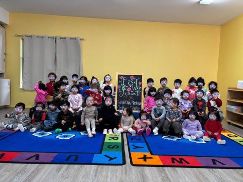 Group photo of BKMCC Childcare children in North Delta during Remembrance Day 2025.